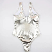 Mandotos Glam Gold and Silver Metallic Swimsuit featuring shiny fabric and a stylish cut, displayed on a mannequin.
