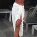 Mandotos GlamourWave chiffon beach wrap draped over a model, showcasing lightweight, elegant fabric perfect for sunny beach days.