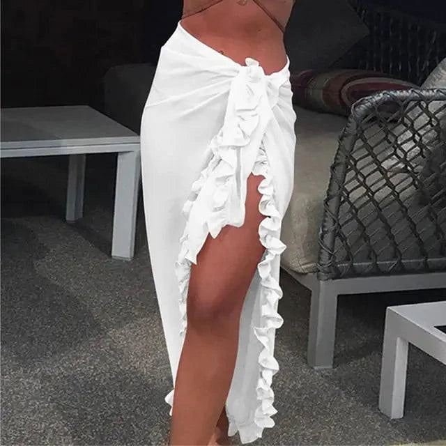 Mandotos GlamourWave chiffon beach wrap draped over a model, showcasing lightweight, elegant fabric perfect for sunny beach days.