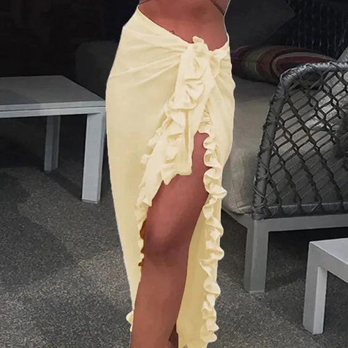 Mandotos GlamourWave chiffon beach wrap draped over a model, showcasing lightweight, elegant fabric for sunny beach days.
