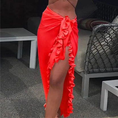 Mandotos GlamourWave chiffon beach wrap draped over a model, showcasing lightweight, elegant design for sunny beach days.