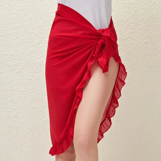 Mandotos GlamourWave chiffon beach wrap draped over a model, showcasing lightweight, elegant fabric for sunny beach days.