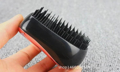 Mandotos GlamWave Luxe hair styling brush with detangling bristles, designed for smooth, shiny hair and effortless styling.