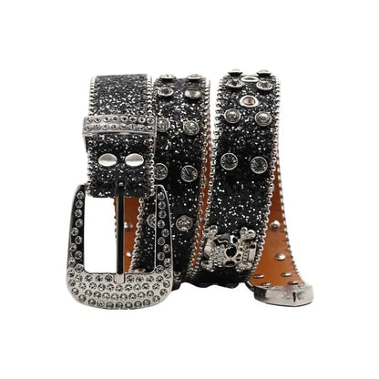 Glitzy skull fashion belt by MANDOTOS with shiny metal skull buckle and black leather strap, stylish accessory for edgy outfits.