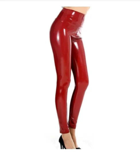 Shiny black glossy latex leather leggings by MANDOTOS, close-up showing smooth, reflective surface and snug fit.