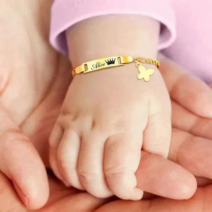 Gold butterfly charm bracelet for kids by MANDOTOS, featuring delicate butterfly charms and a secure clasp.