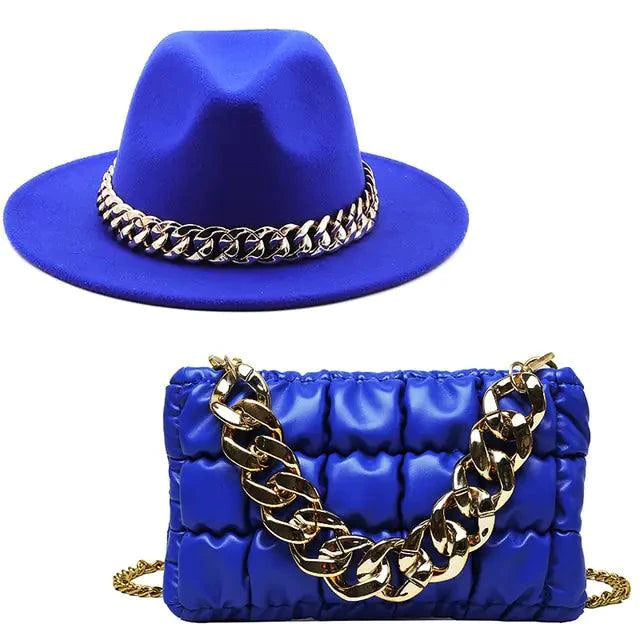 Luxury gold chain fedora hat by MANDOTOS featuring a stylish gold chain detail on a classic fedora design.
