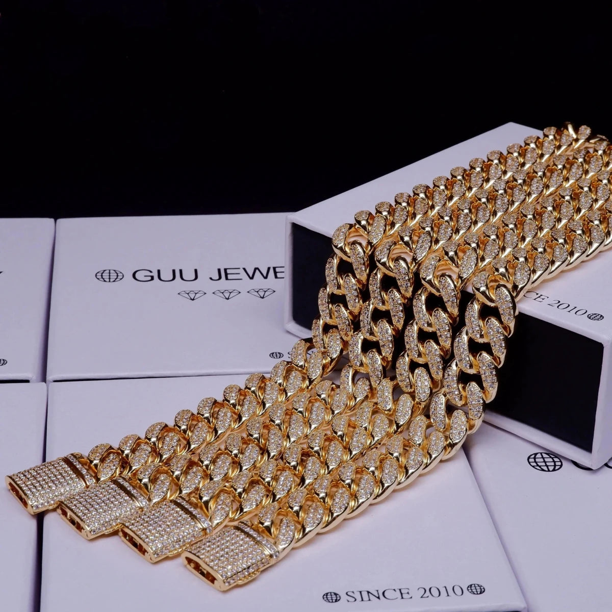 Mandotos Gold Shine Iced Cuban Chain with luxe style upgrade, featuring a thick gold-tone chain with sparkling iced accents.