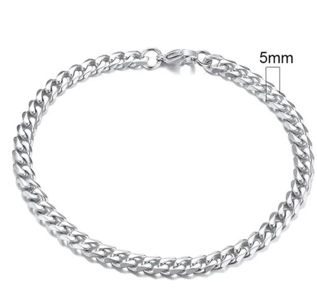 Gold-tone stainless steel Cuban bracelet with 3-11mm links, crafted by MANDOTOS, showcasing a sleek and polished design.
