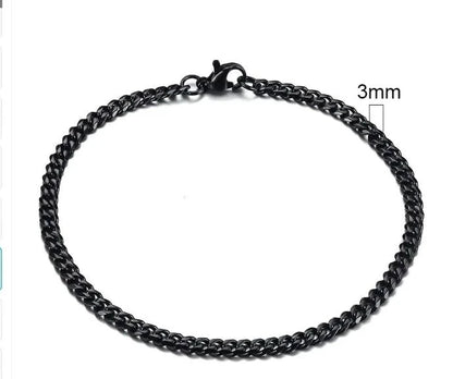 Gold-tone stainless steel Cuban bracelet with 3-11mm links, crafted by MANDOTOS, displayed in a close-up image.