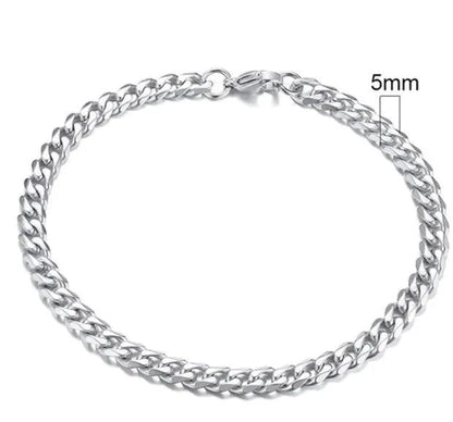 Gold-tone stainless steel Cuban bracelet by MANDOTOS, featuring 3-11mm wide links, displayed on a neutral background.