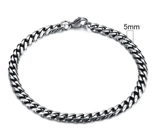 Gold-tone stainless steel Cuban bracelet by MANDOTOS, 3-11mm wide, featuring classic interlocking links on a sleek design.