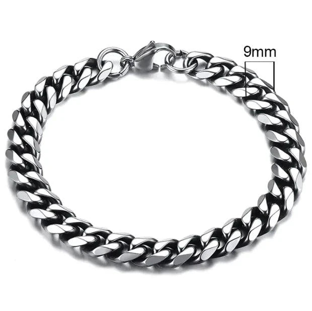 Gold-tone stainless steel Cuban bracelet from MANDOTOS, 3-11mm width, featuring polished, interlocking links on a sleek design.