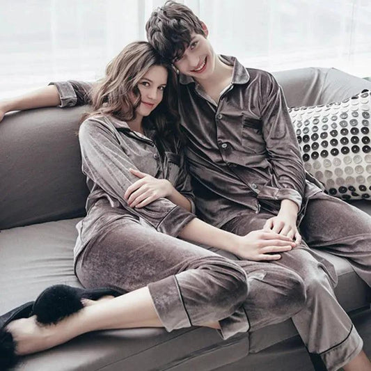 Gold velvet pajamas from MANDOTOS with a soft, luxurious fabric and relaxed fit, shown on a model in a cozy bedroom setting.