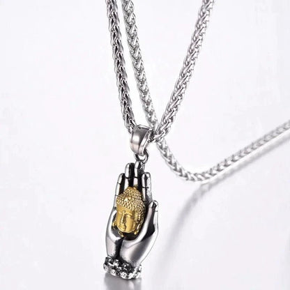 Golden Buddha pendant by MANDOTOS featuring a detailed, shiny metal pendant with intricate Buddha design on a chain.