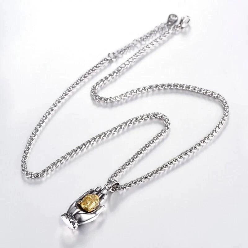 Golden Buddha pendant from MANDOTOS featuring intricate design and polished gold finish, hanging on a delicate chain.