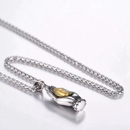 Golden Buddha pendant from MANDOTOS featuring a detailed, polished gold design suitable for jewelry or spiritual wear.