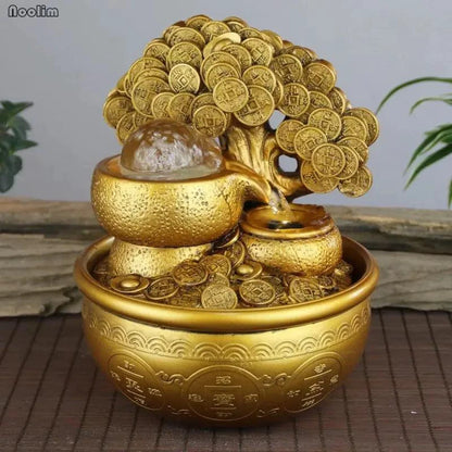 Mandotos Golden Prosperity Tree Fountain with flowing water and decorative gold finish on a lush green base.