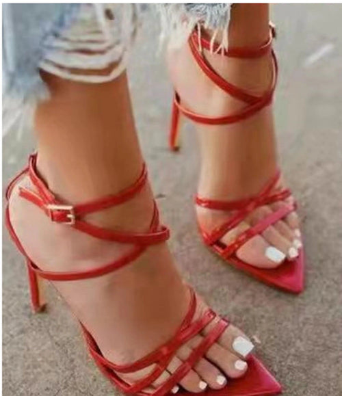 Golden strappy stiletto pumps by MANDOTOS featuring sleek design and high heels, perfect for stylish evening wear.