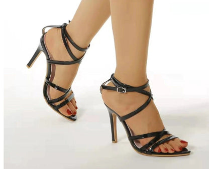 Golden strappy stiletto pumps by MANDOTOS with sleek design and high heels, perfect for elegant evening wear.