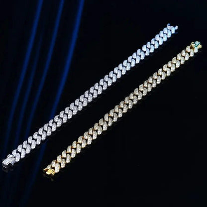 18k gold Cuban link bracelet by MANDOTOS, showcasing a bold and shiny gold flex chain with intricate link details.