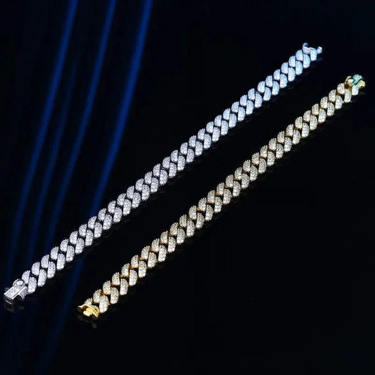 18k gold Cuban link bracelet by MANDOTOS, showcasing a bold and shiny gold flex chain with intricate link details.