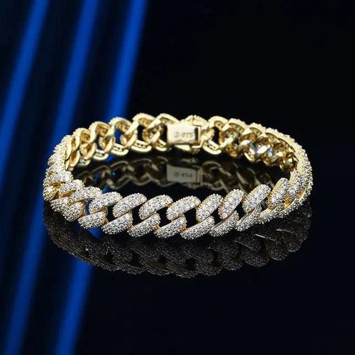 GoldFlex 18k Cuban link bracelet by MANDOTOS, showcasing a shiny gold chain with a secure clasp on a white background.
