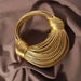 Mandotos women's luxury handbag in gold, handwoven noodle design, rope knotted hobo style, silver evening clutch for stylish occasions.