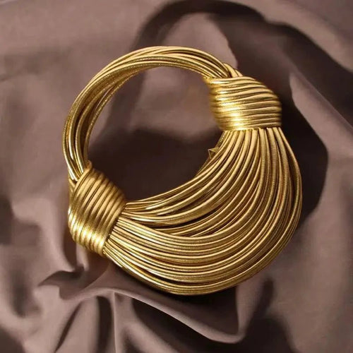 Mandotos women's luxury handbag in gold, handwoven noodle design, rope knotted hobo style, silver evening clutch for stylish occasions.