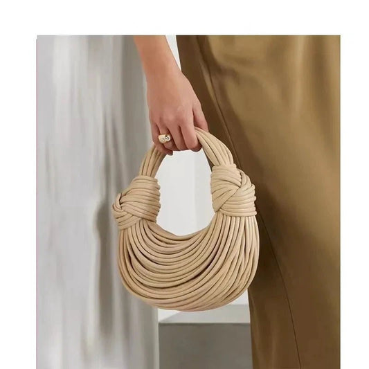 Mandotos women's luxury gold evening clutch handbag with handwoven noodle design, rope knot accents, and silver finish.