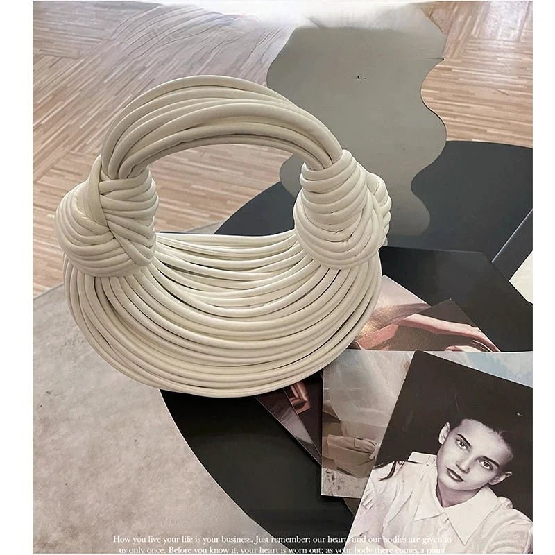 Mandotos gold luxury designer handbag with handwoven noodle design, rope knots, and silver evening clutch style for women.