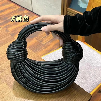 Mandotos gold luxury designer handbag for women, handwoven noodle style with rope knot details, silver evening clutch design.