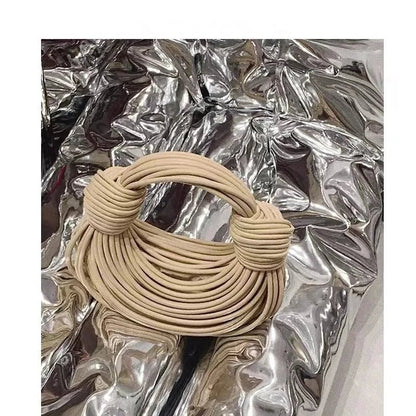 Mandotos women's 2025 gold luxury designer handbag with handwoven noodle design, rope knots, and silver evening clutch style.