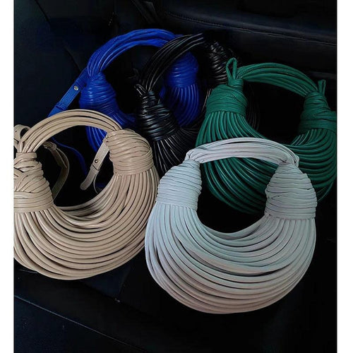 Mandotos luxury women's handbag in gold with handwoven noodle design, rope knots, and silver evening clutch style.