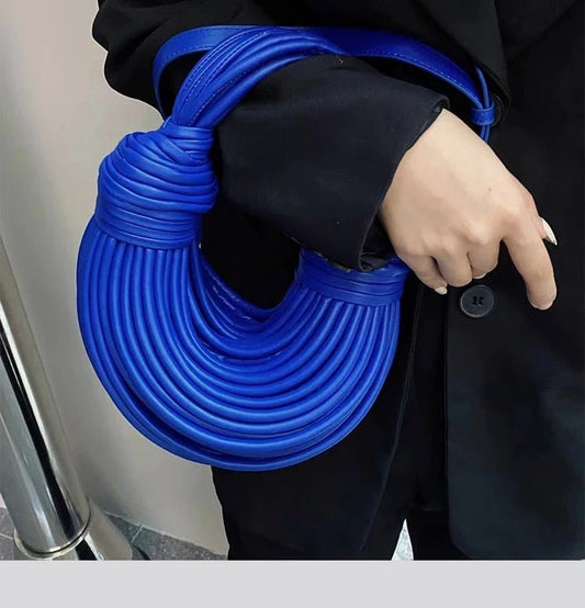 Mandotos luxury women's handbag, gold handwoven noodle design with rope knots, silver evening clutch, stylish and elegant for 2025.