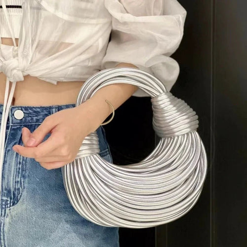 Mandotos women's 2025 luxury gold designer handbag with handwoven noodle design, rope knotted accents, and silver evening clutch style.