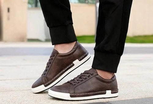 Mandotos handmade men's casual closed-toe trainers showing black leather upper and comfortable sole detail.