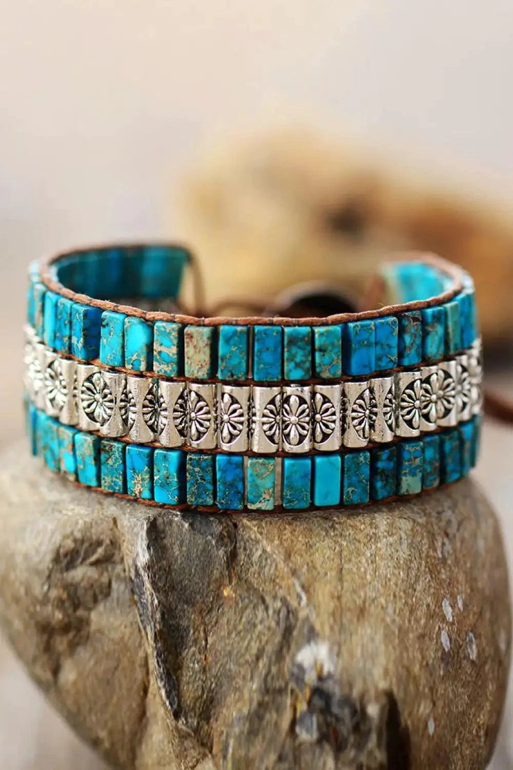 Handmade triple-layer natural stone bracelet by MANDOTOS featuring smooth, polished stones on a durable elastic cord.