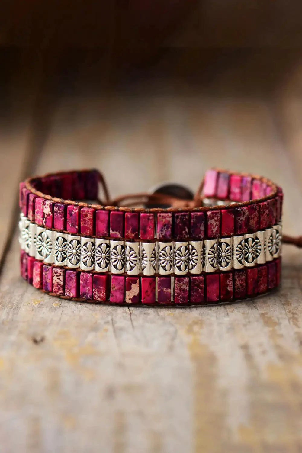 Handmade triple-layer natural stone bracelet by MANDOTOS featuring smooth, rounded stones in earthy tones.