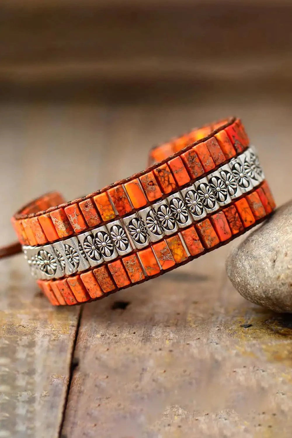 Handmade triple-layer natural stone bracelet by MANDOTOS showing various colorful stones and adjustable cord design.