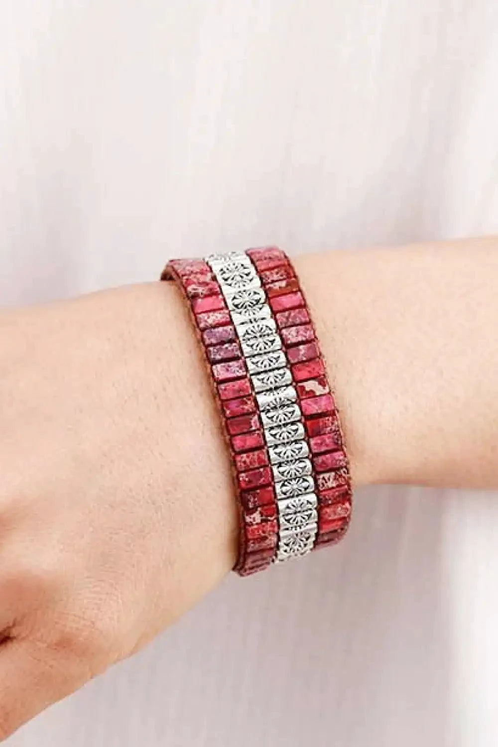 Handmade triple-layer natural stone bracelet from MANDOTOS featuring polished stones and adjustable cord design.