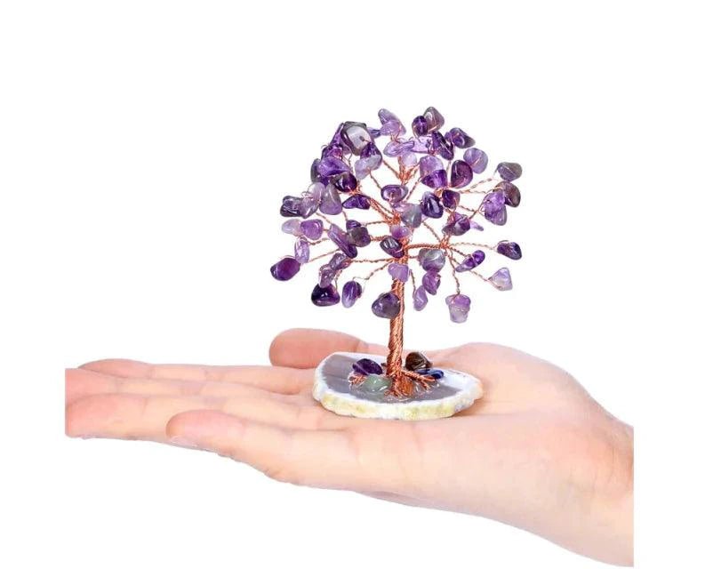 Mandotos Harmony Energy Feng Shui Trees in a decorative display with lush green foliage and natural wooden trunks.