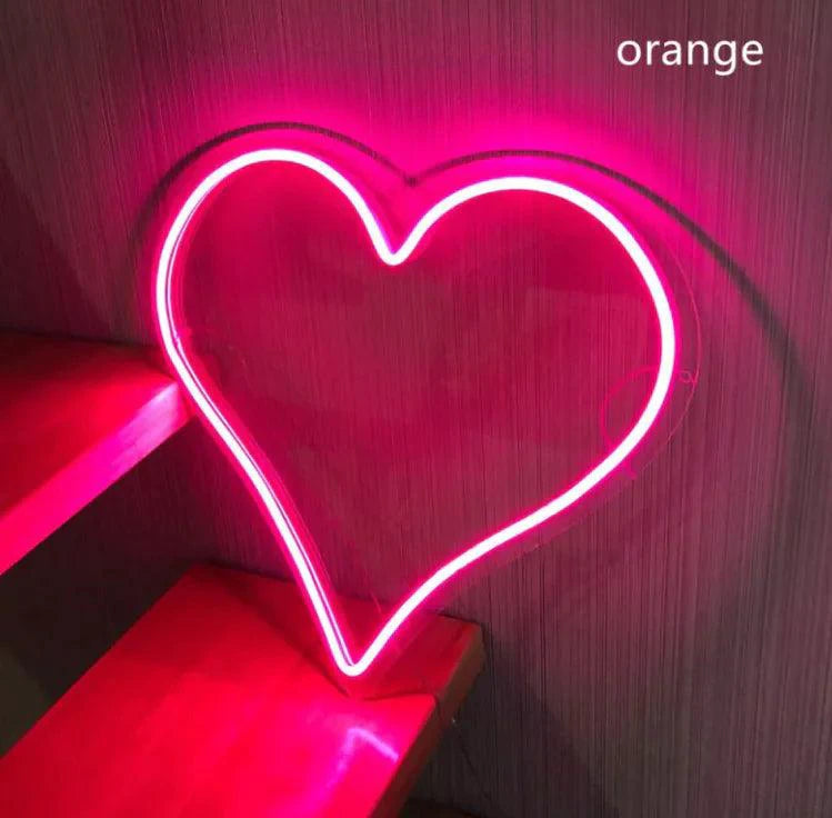 Mandotos Heart Glow LED Neon Light illuminating a vibrant pink heart shape, perfect for modern home decor or romantic ambiance.
