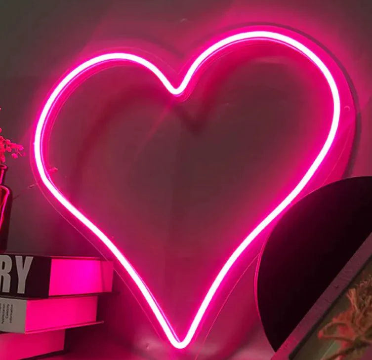 Mandotos Heart Glow LED Neon Light glowing with vibrant pink and white colors, perfect for room decor or ambiance lighting.