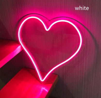 Mandotos Heart Glow LED neon light illuminated in vibrant pink, perfect for wall decor or ambient lighting.