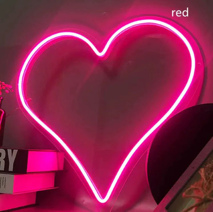 Mandotos Heart Glow LED neon light glowing pink, ideal for room decor or creating cozy ambient lighting.