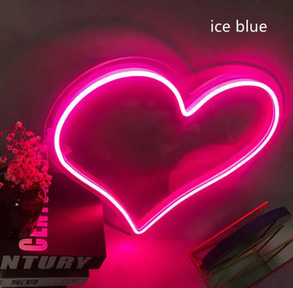 Mandotos Heart Glow LED neon light illuminated with vibrant pink glow, perfect for decorative indoor lighting.