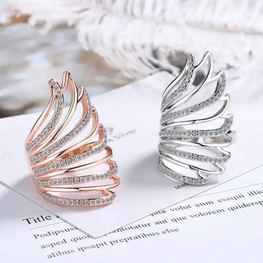 Mandotos Heavenly Diamond Wing Ring featuring sparkling diamonds and intricate wing design on a silver band.