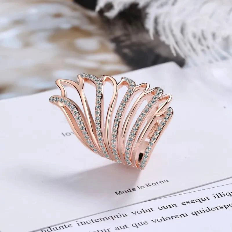 Mandotos Heavenly Diamond Wing Ring with sparkling diamonds and intricate wing design in sterling silver or white gold.