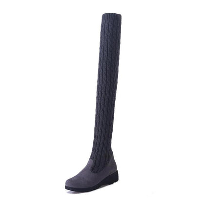 Mandotos high flat over-the-knee stretch Martin boots showcasing sleek black leather and knee-high design.